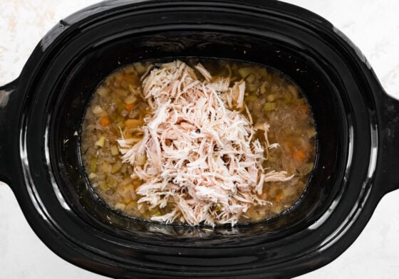 Shredded chicken added back to slow cooker.