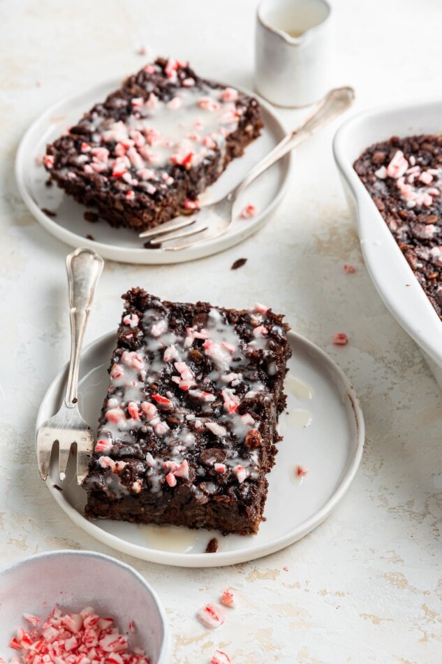 Two slices of chocolate peppermint baked oatmeal on plates.