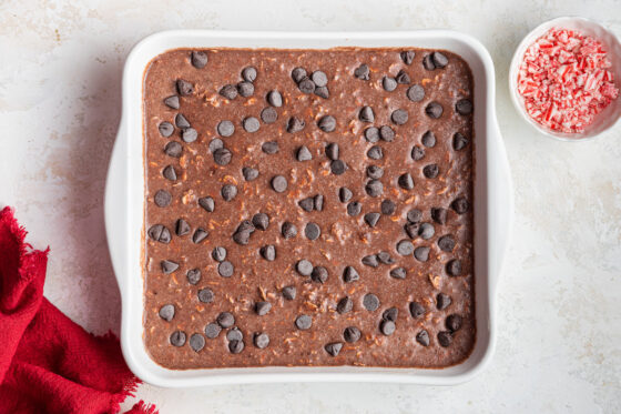 Oatmeal mixture spread into a baking dish.