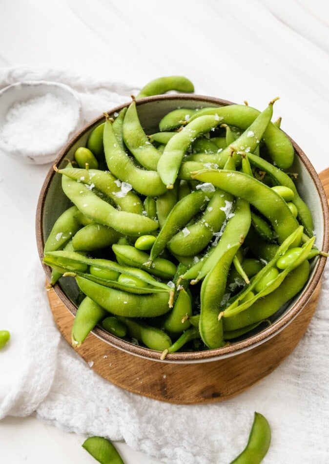 A bowl of cooked edamame.