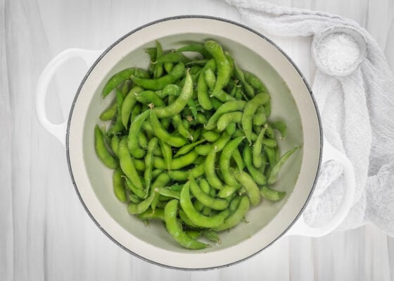 Edamame cooking in the water.