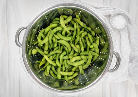 Edamame in a strainer.