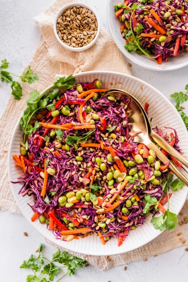 A serving bowl containing asian edamame salad.