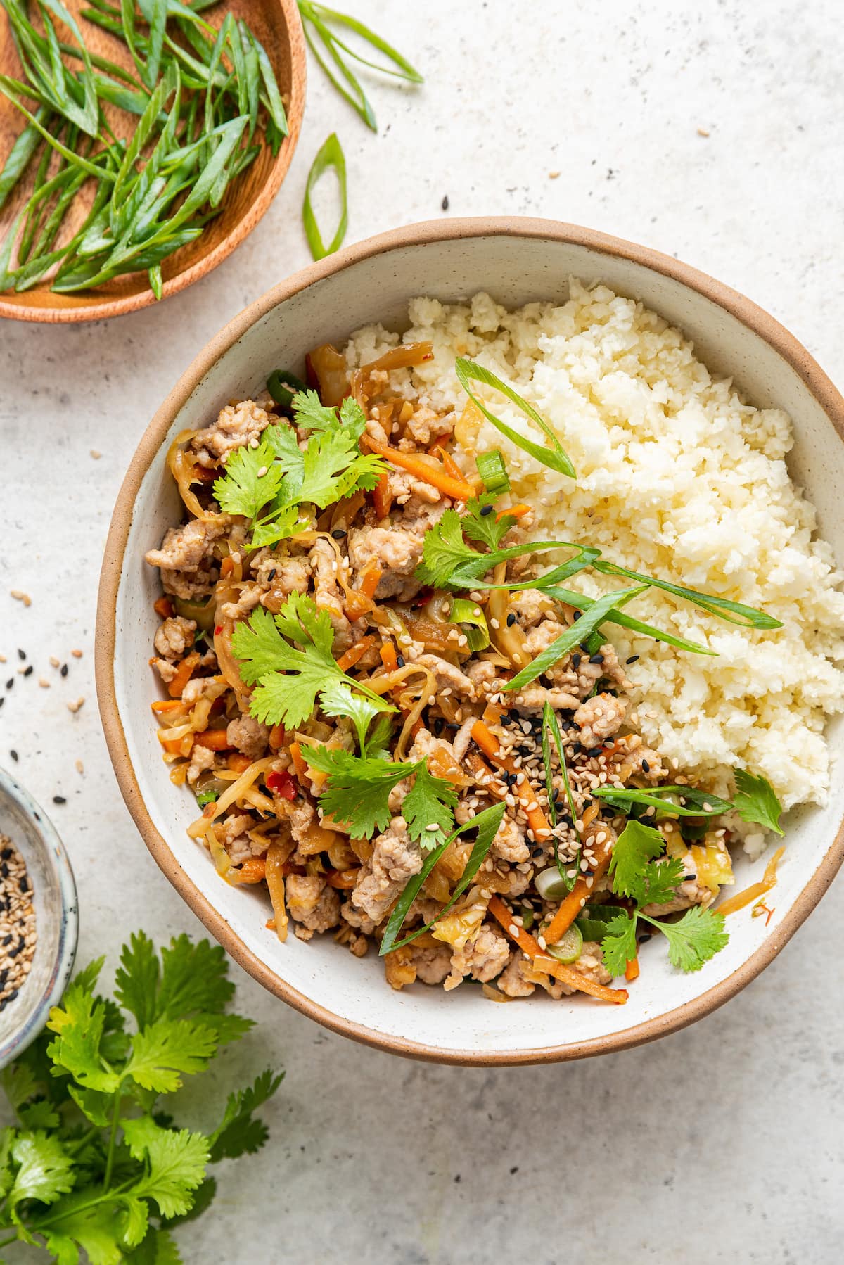 Egg roll in a bowl served with rice.