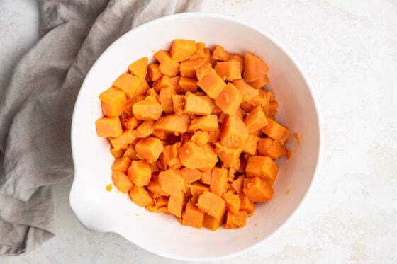 Cubed and boiled sweet potatoes in a bowl.