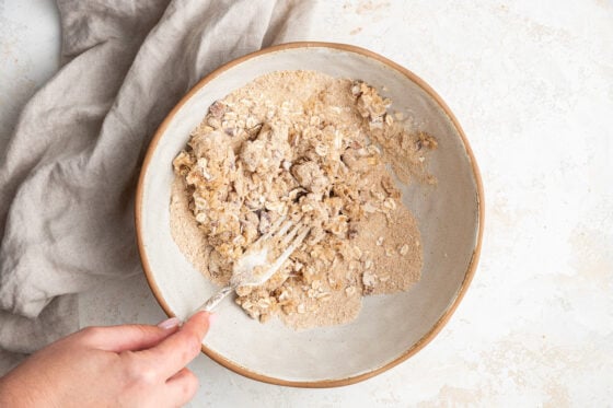 Oatmeal topping mashed together with a fork.