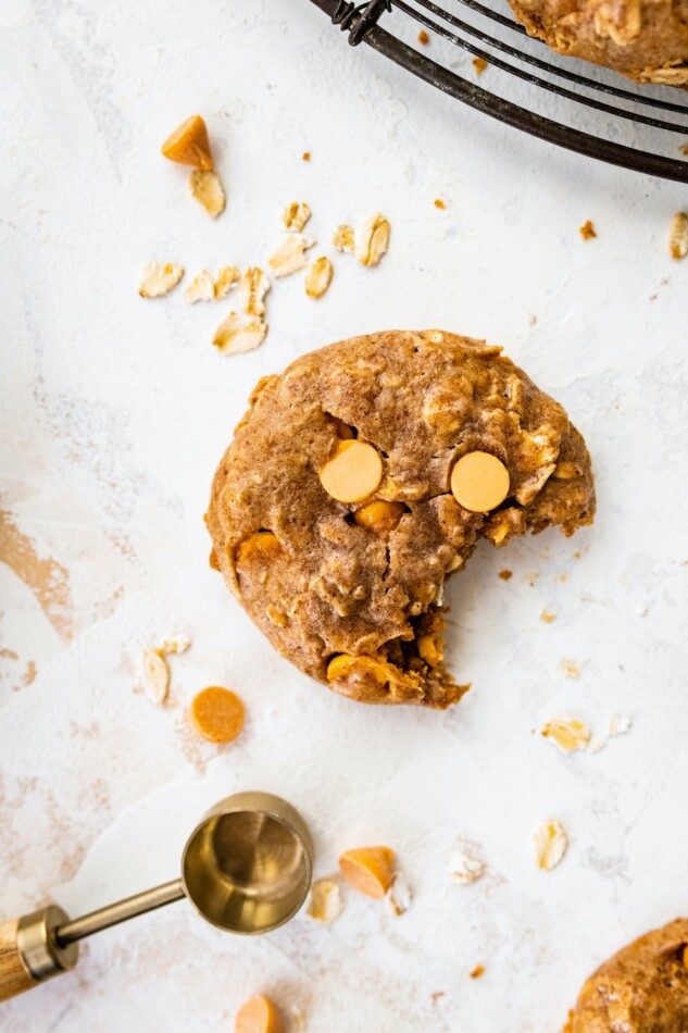 A cookie with a bite taken out of it.