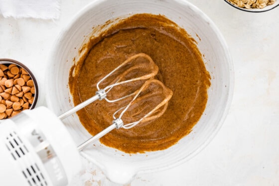 Ingredients mixed together in bowl with a hand mixer.