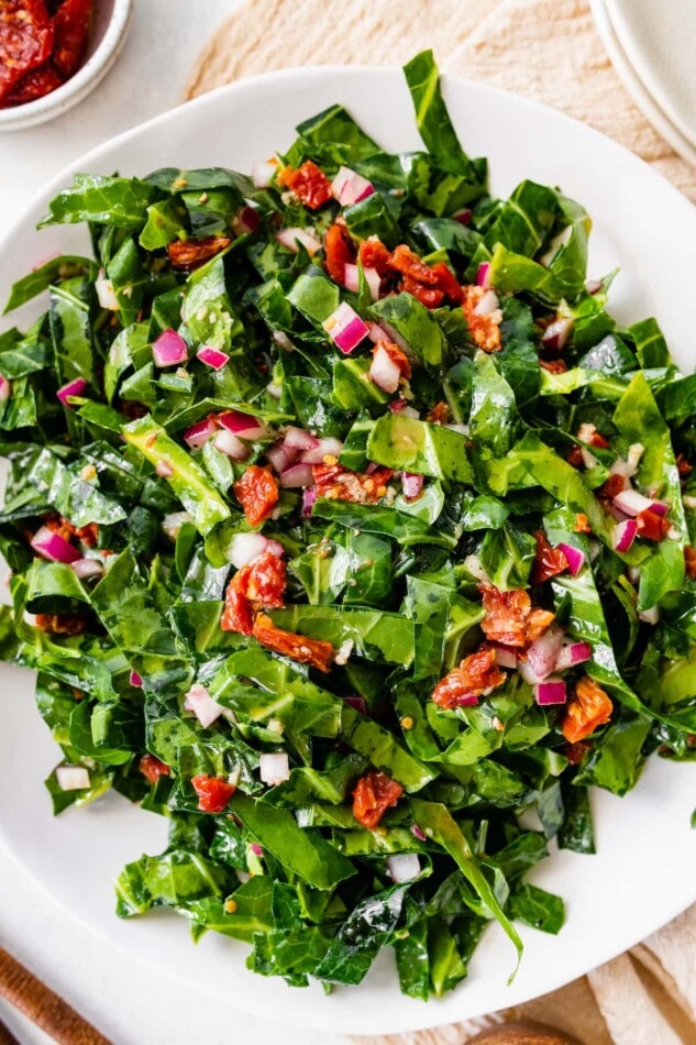 A plate of raw collard greens salad.