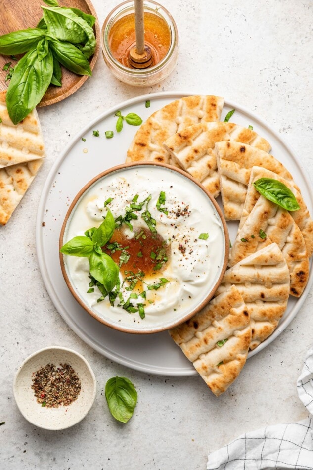 Whipped feta dip served with a platter of pita.