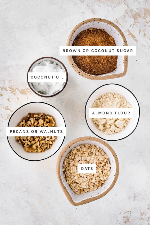 Ingredients measured to make topping for Healthy Apple Crisp: coconut sugar, coconut oil, almond flour, walnuts and oats.
