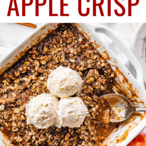 A healthy apple crisp topped with three scoops of ice cream.