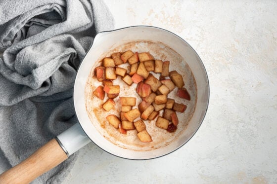 Apple chunks cooked in a sauce pan.