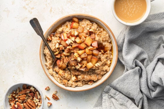 Oatmeal topped with cooked apples.