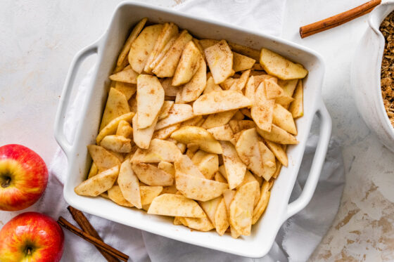 Apple slices arranged in a baking dish.