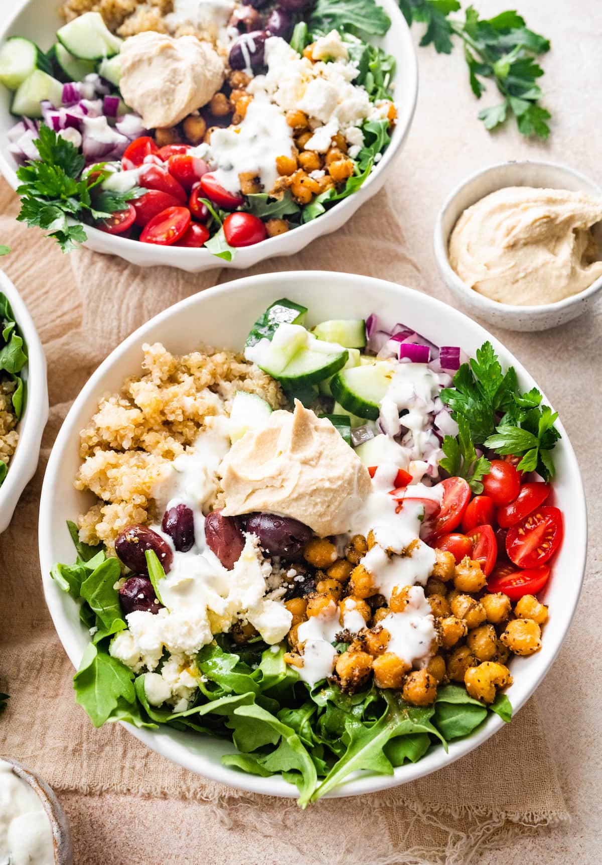 Two mediterranean quinoa bowls.