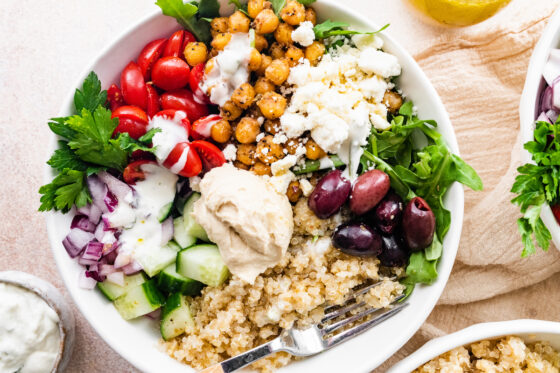 An assembled mediterranean quinoa bowl.