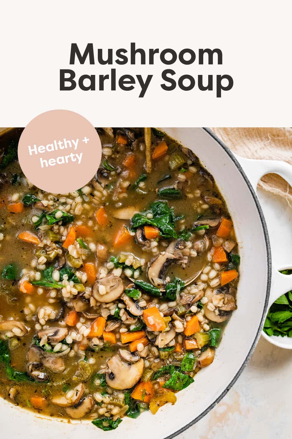 Pot of mushroom barley soup with a ladle.