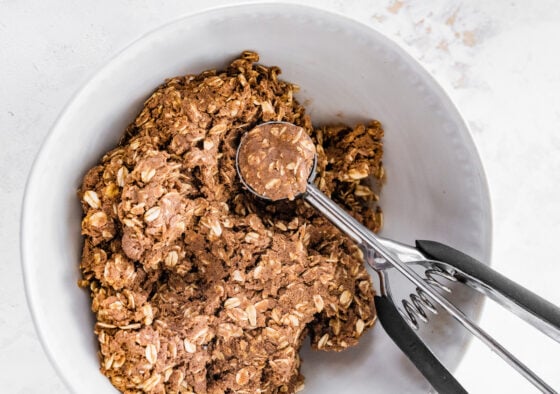 A cookie scoop used to portion out protein balls.