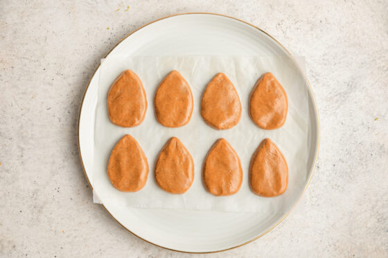 Peanut butter mixture molded into 8 egg shaped pieces.