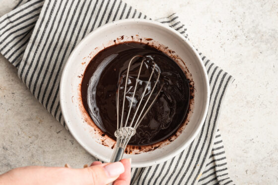 Whisking together chocolate coating.