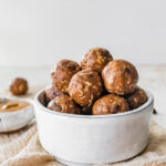 A bowl of chocolate peanut butter protein balls.