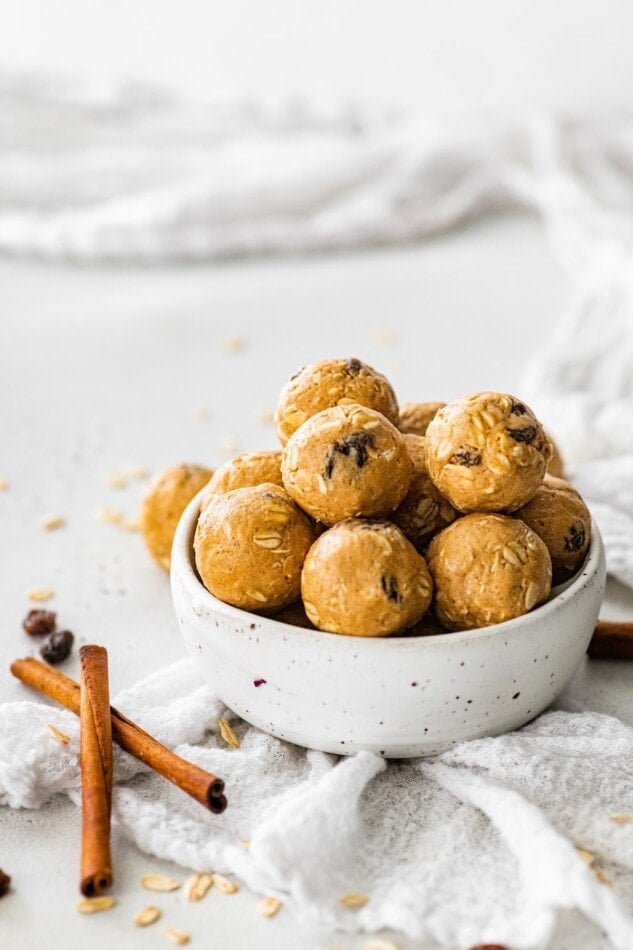 Cinnamon raisin protein balls in a bowl.