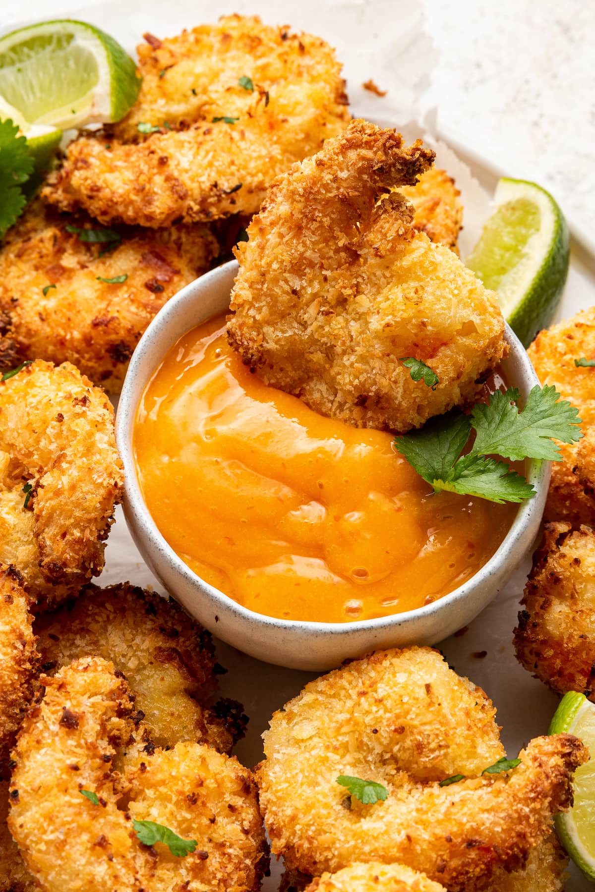 Coconut shrimp served with sauce.