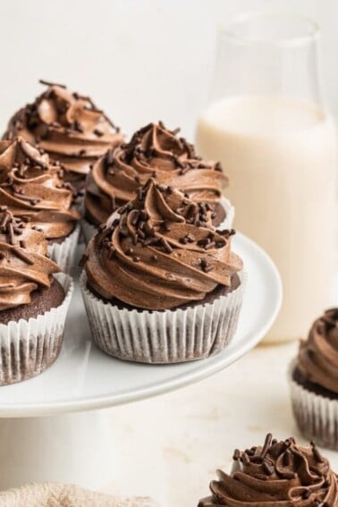 Healthy chocolate cupcakes displayed on a cake stand.