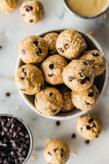 A bowl of tahini chocolate chip protein balls.