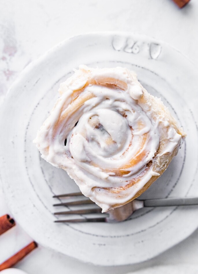 A cinnamon roll on a plate.