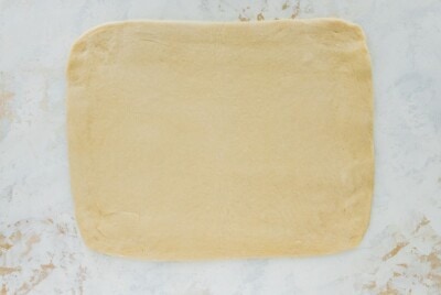 Dough rolled into a rectangle.