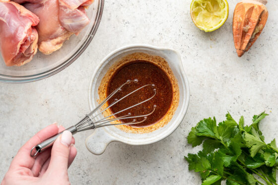 Whisking ingredients into a marinade.