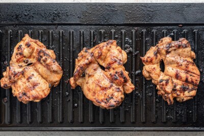 Grilling marinated chicken.