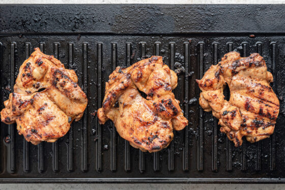 Grilling marinated chicken.
