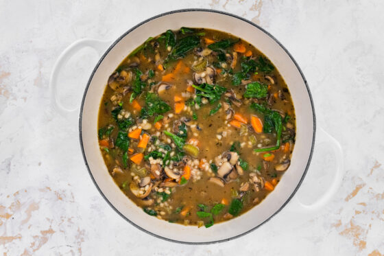 Mushroom barley soup in a pot.