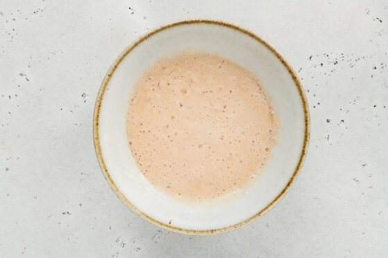 Yeast and milk in a bowl.