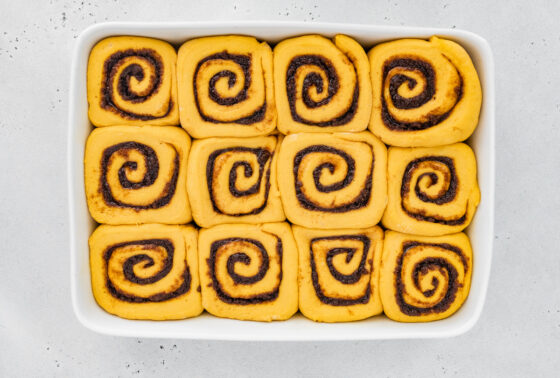 Rolls after proofing in baking dish.