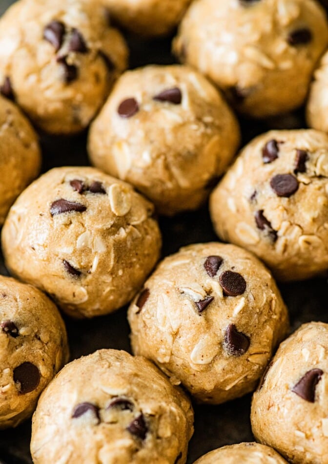 Rows of tahini chocolate chip protein balls.