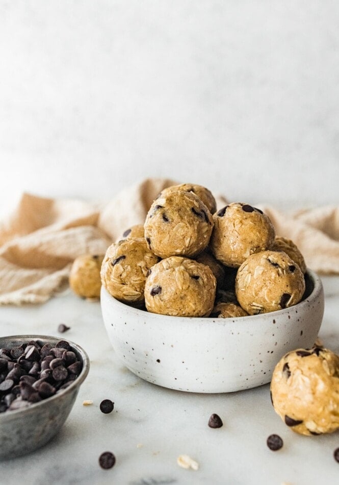 A bowl of tahini chocolate chip protein balls.