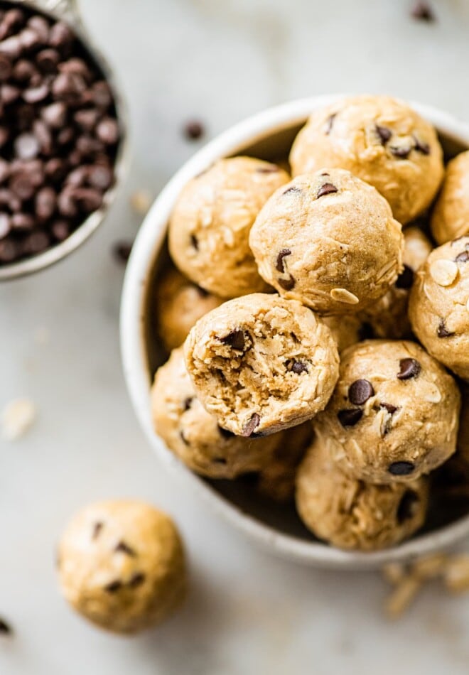 A bowl of tahini chocolate chip protein balls.