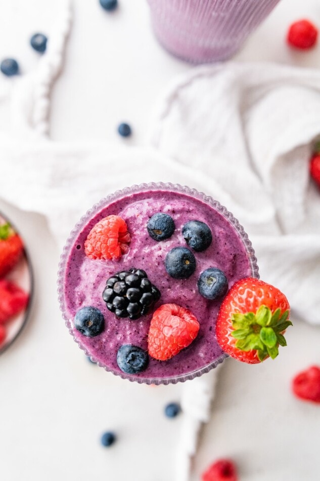 A vegan protein shake topped with extra berries.