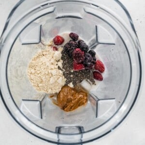 Ingredients for a vegan protein shake in a high powered blender.