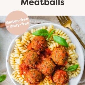 Turkey Spinach Meatballs served over pasta with marinara sauce.