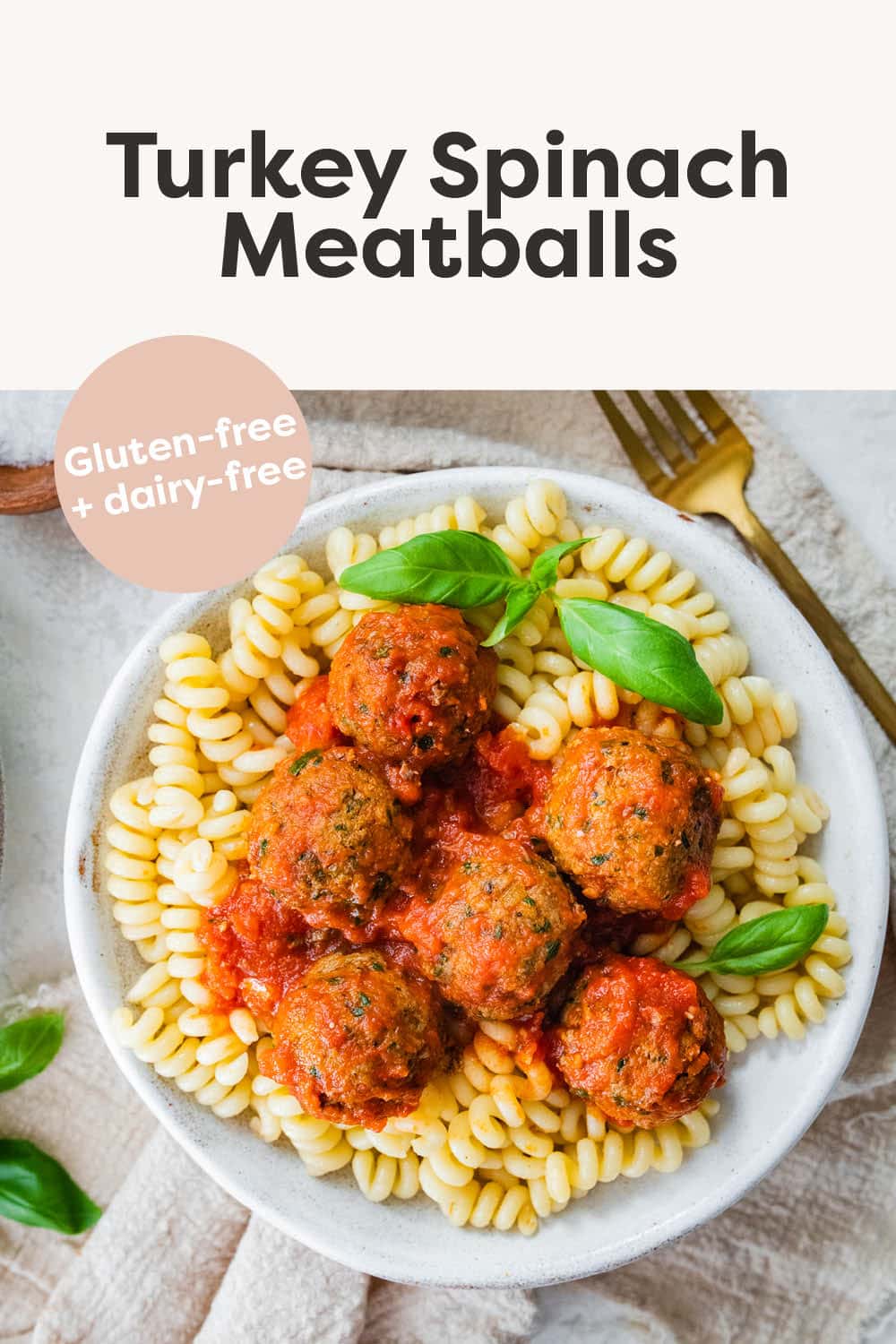 Turkey Spinach Meatballs served over pasta with marinara sauce.