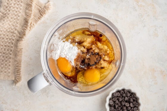 Ingredients for banana blender muffins in a high powered blender.