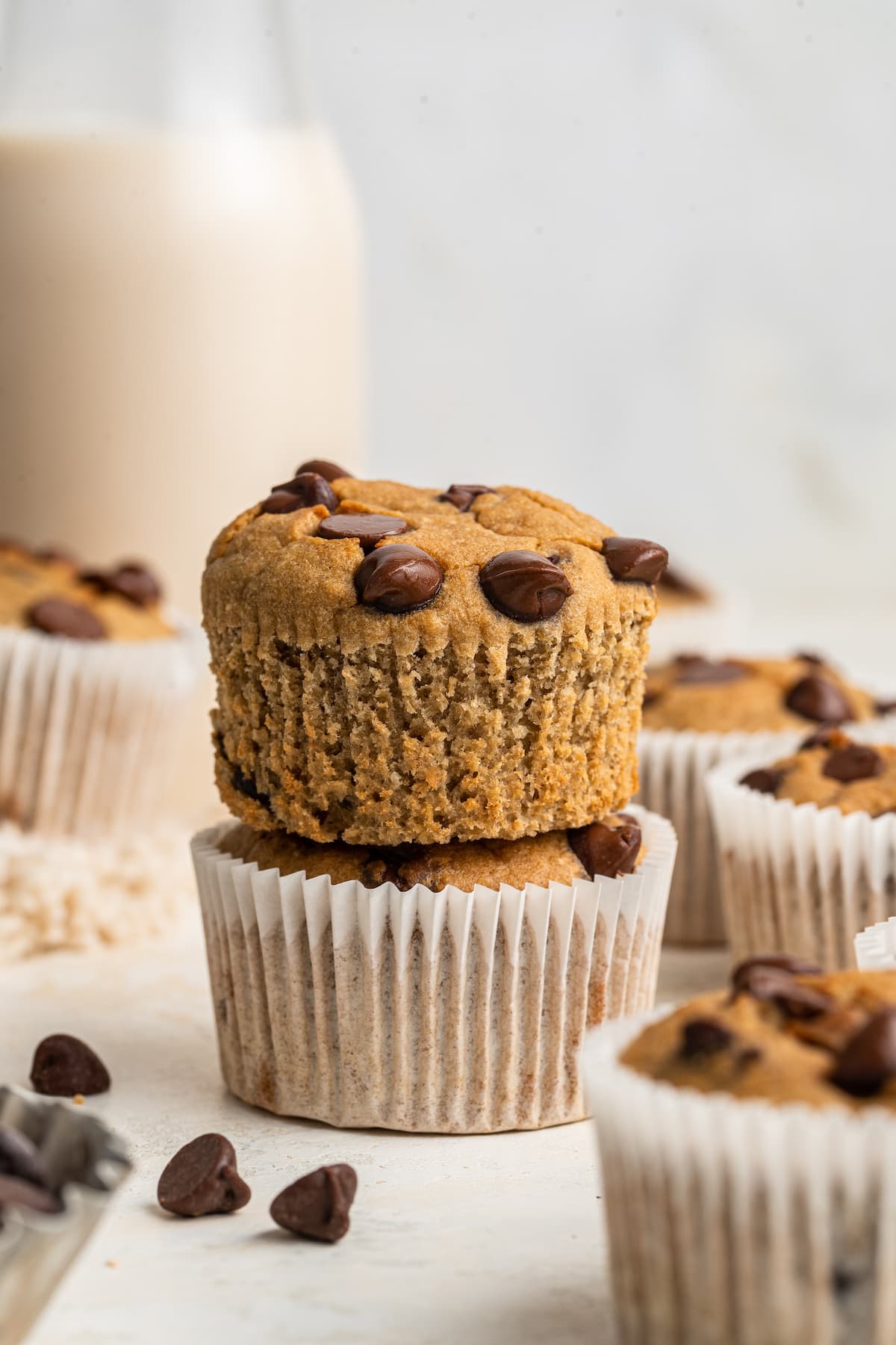 Two banana blender muffins. The liner has been removed from the top muffin.