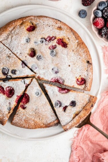 An easy berry cake cut into slices.