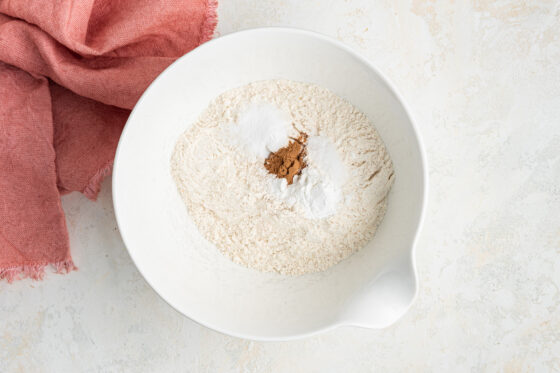 Flour, baking powder, baking soda, salt and cinnamon in a medium mixing bowl.