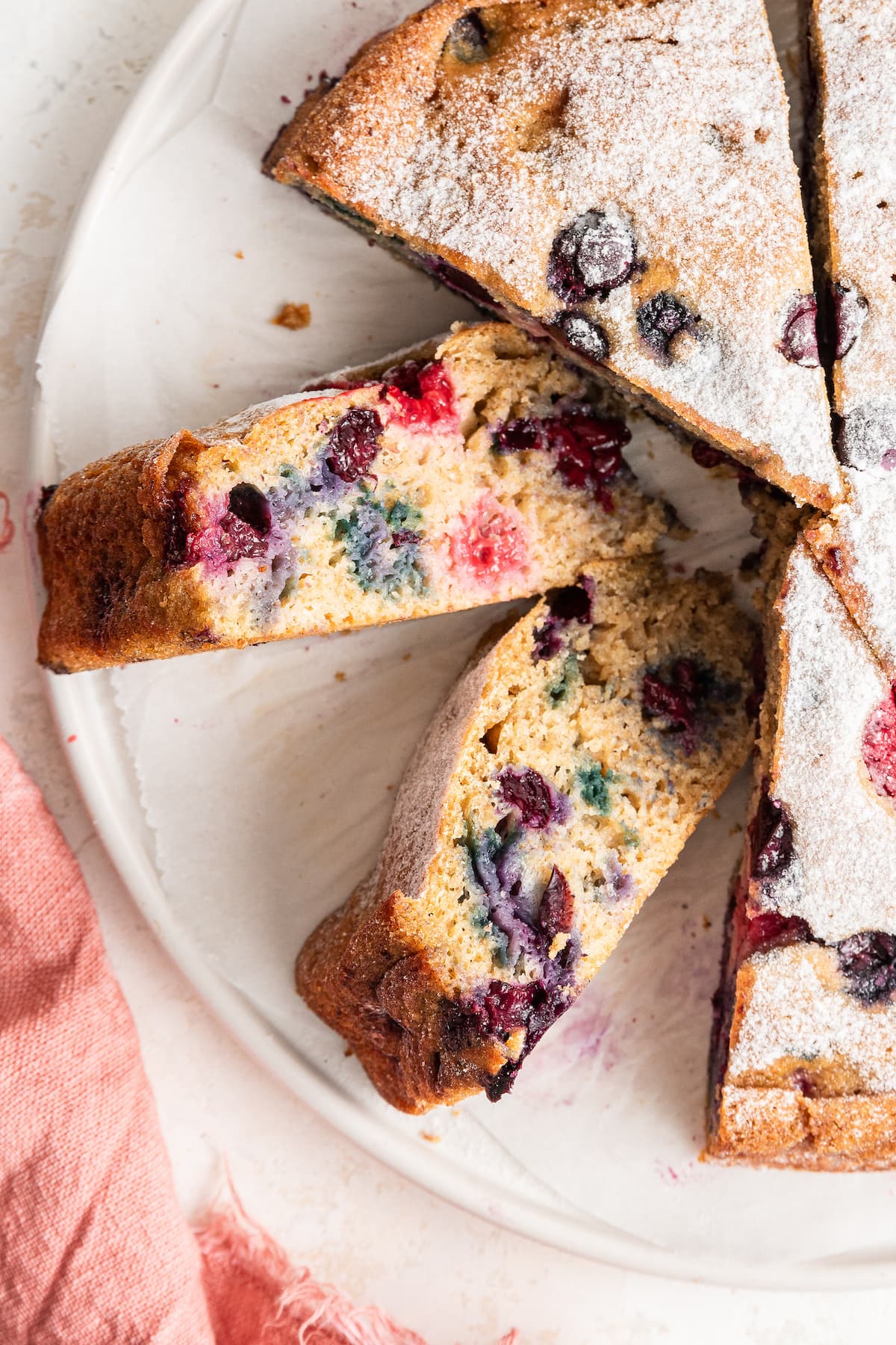 Slices of easy berry cake on their side.